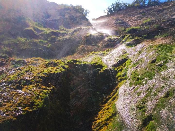 Under a waterfall