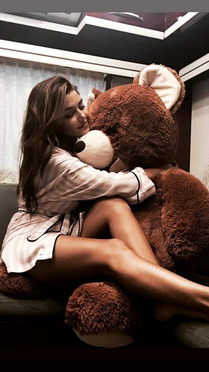 Hande cutie hug her bear