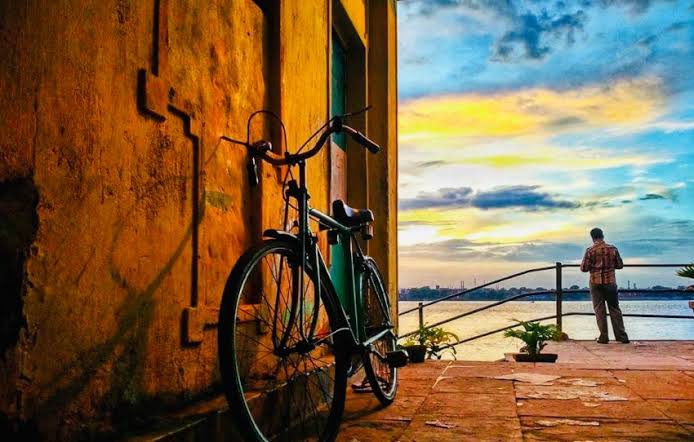 When engaged with a rusty bicycle leaning against the wall