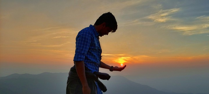 holding sun in hand