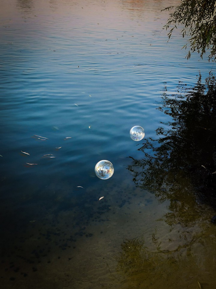 travel of two small soap bubbles.
