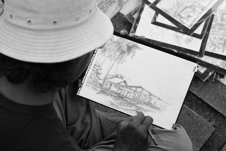 old man drawing on the streets
