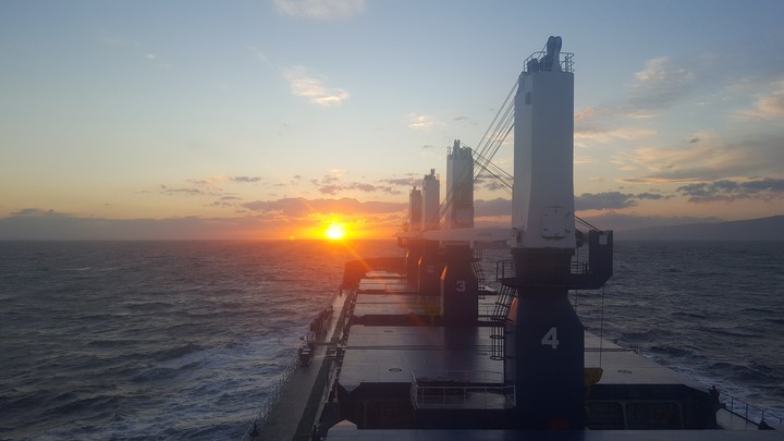 sunset ship sailing