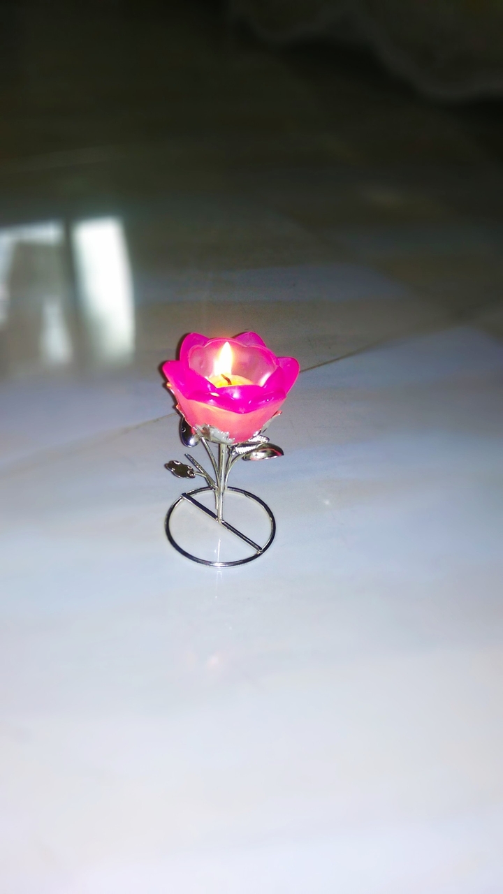 A Flower with candle in it