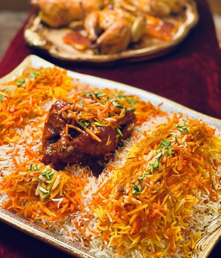 Persian Jeweled carrot rice with stuffed cornish Hen
