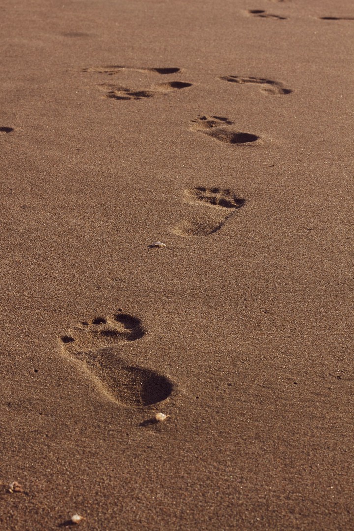 Footprints in the golden sand