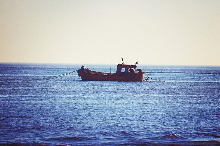 boot boat swimming alone