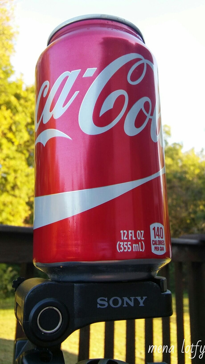cola on camera holder