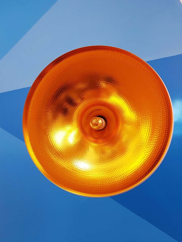 orange on blue wall
