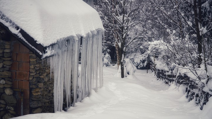 icicles on the side of a cabin