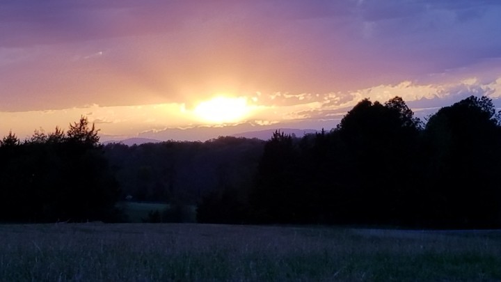 Sunset Peaking Over Clouds