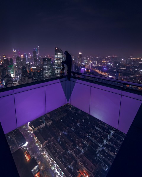 man standing at rooftop
