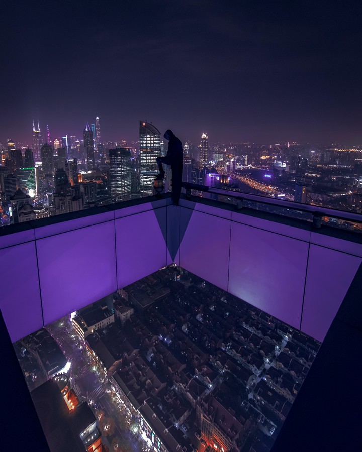 man standing at rooftop