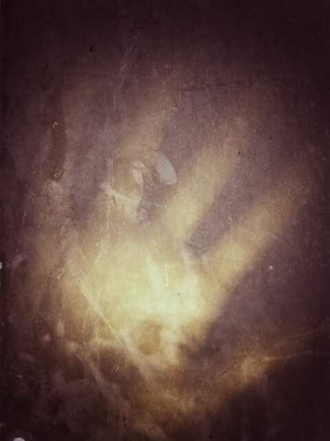 Scary hand behind the glass