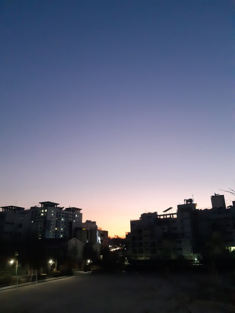 The sun is nearly gone, The lights are turning on