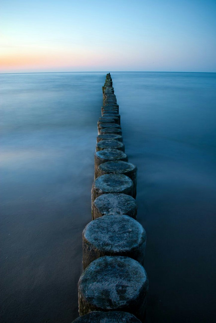 Brown Wooden Poles on Sea Water during Daytime :)