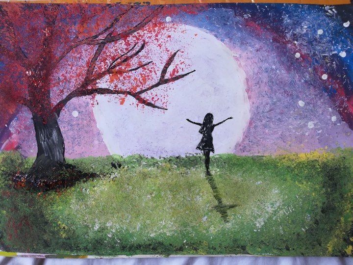 Girl looking at the full moon