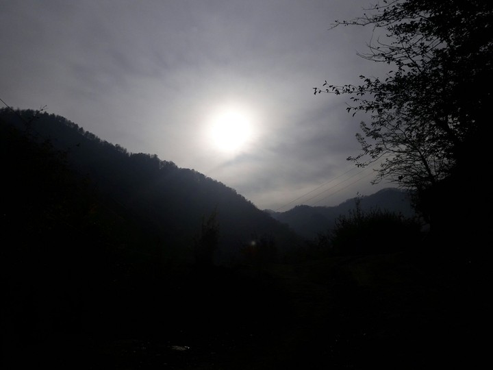 Sun in backside of clouds