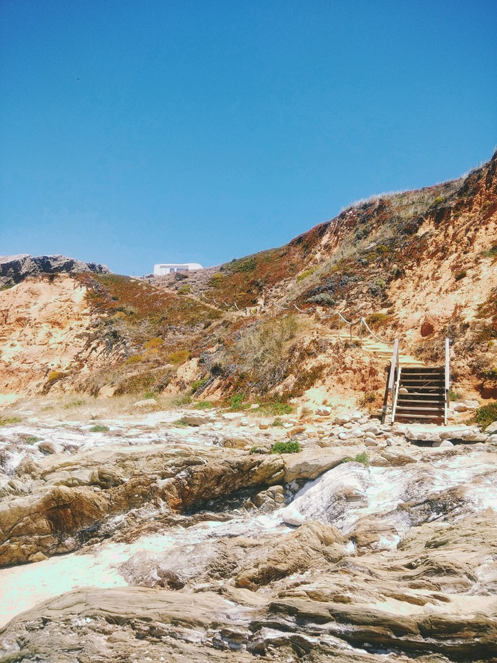 rocky beach with blue sky