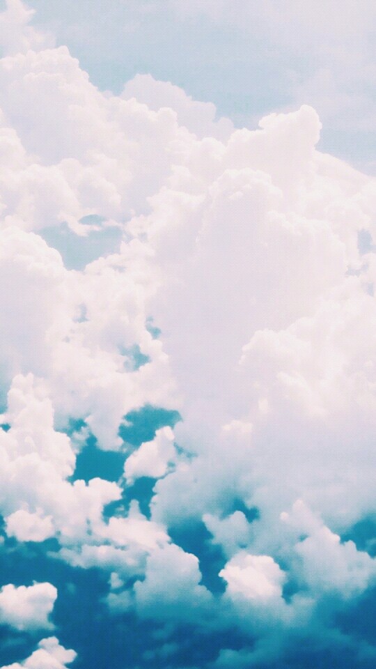 soft, fluffy clouds in blue, blue sky