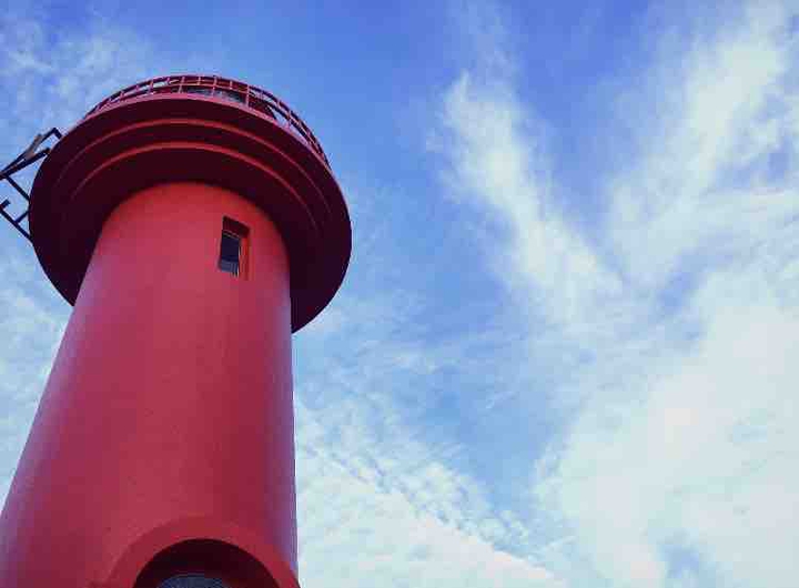 the blue sky above the lighthouse