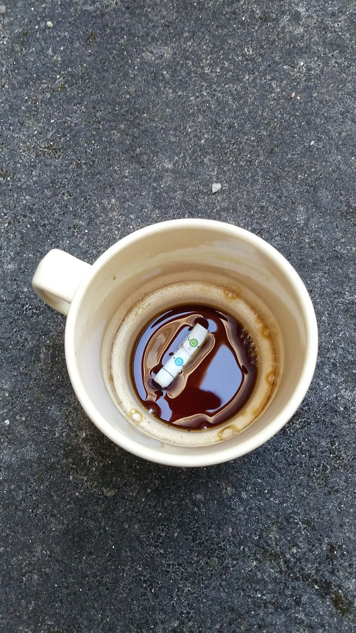 Cigarrete in a mug.