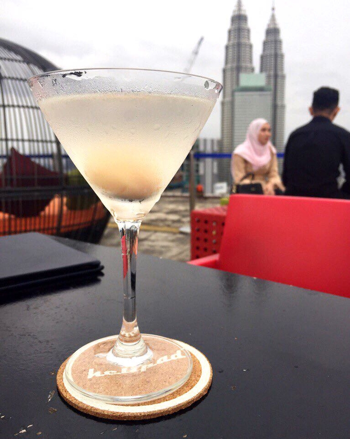 drinking cocktail on the rooftop.