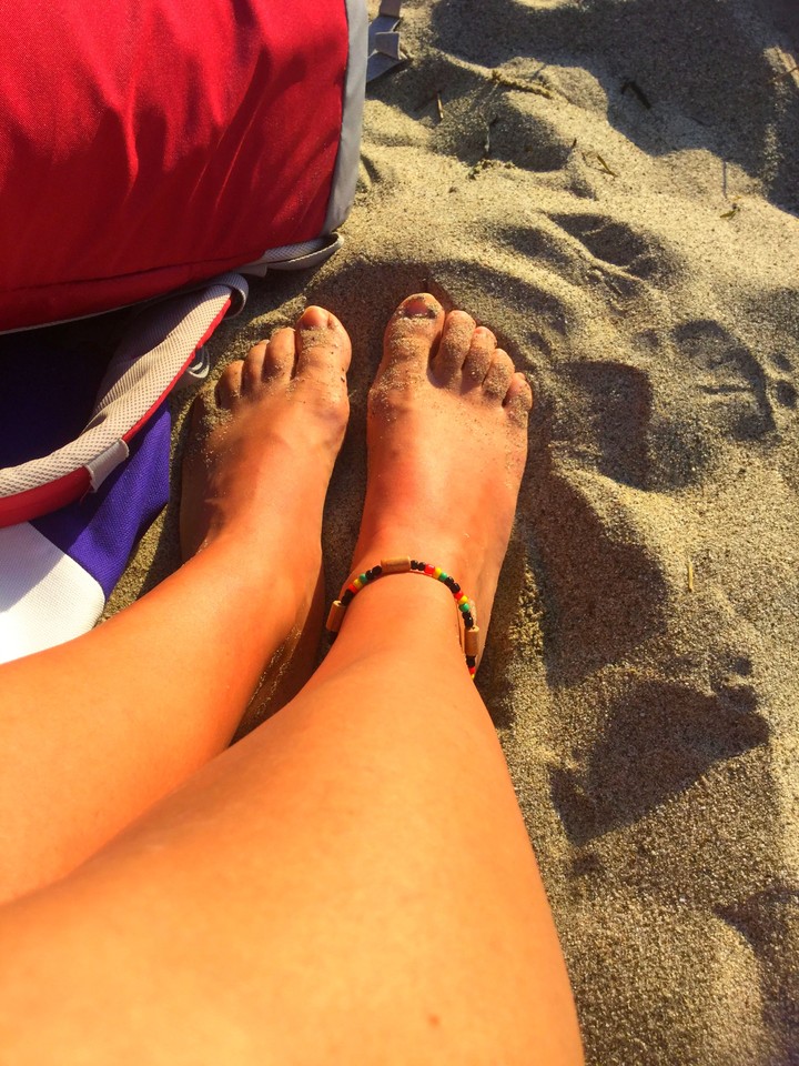 feet on the  beach