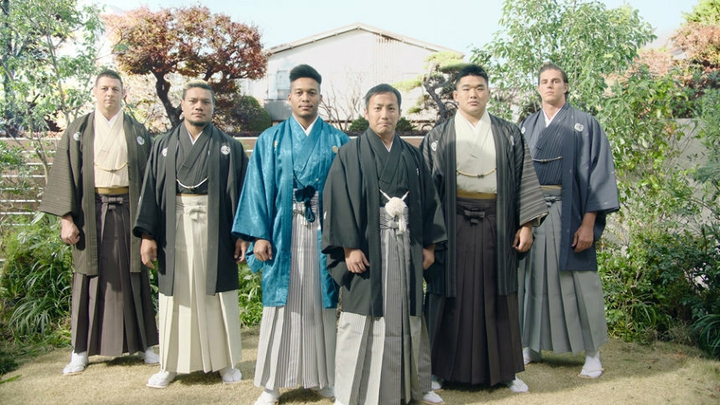 rugby team in traditional formal attire