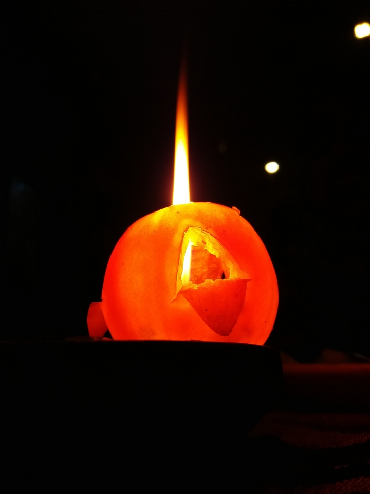 Candle in a tomatoe