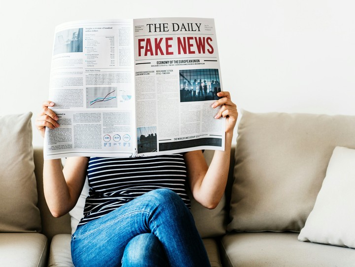 woman reading newspaper