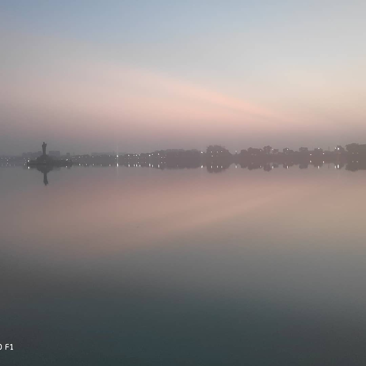 A reflection of sky and water body.