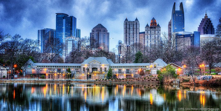 house with skyscrapers near lake