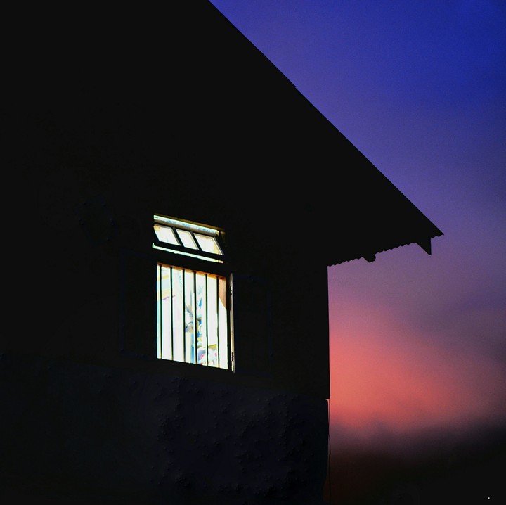 Rain and Twilight descend upon a little cottage