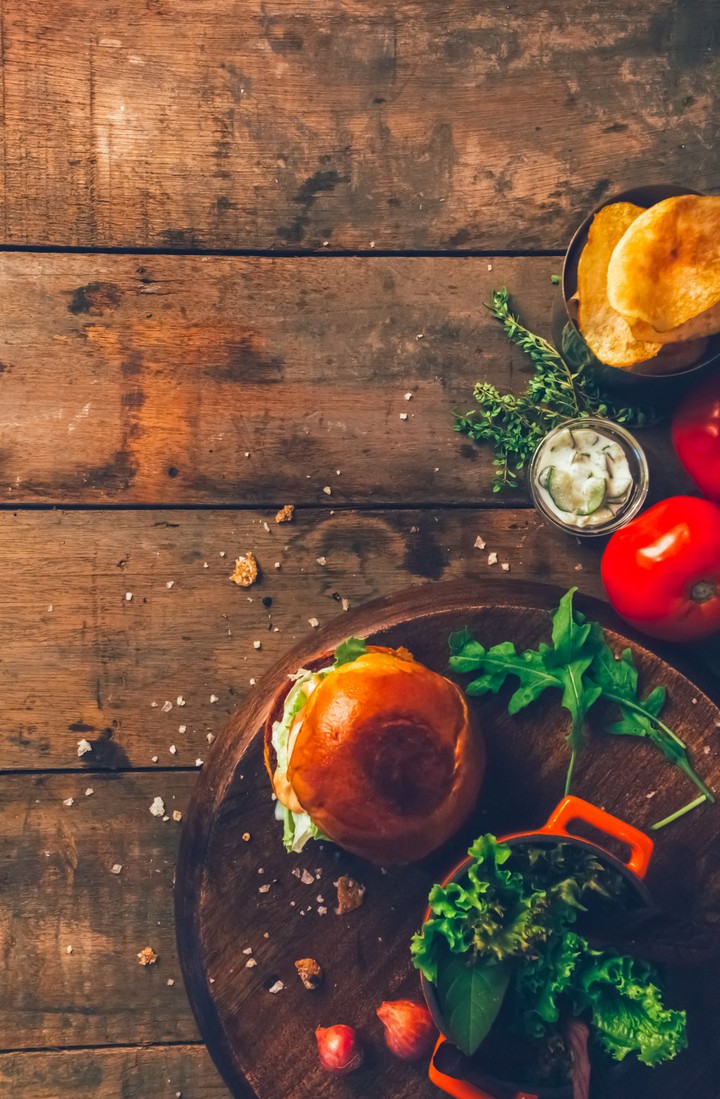 burger tomato and green fresh vegetables on the wood table