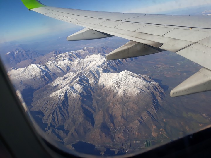 snowy mountains from aeroplane