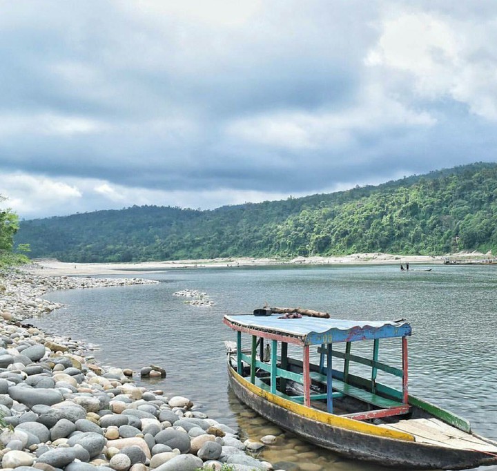 Beautiful Boat On Water Front Of A Hill