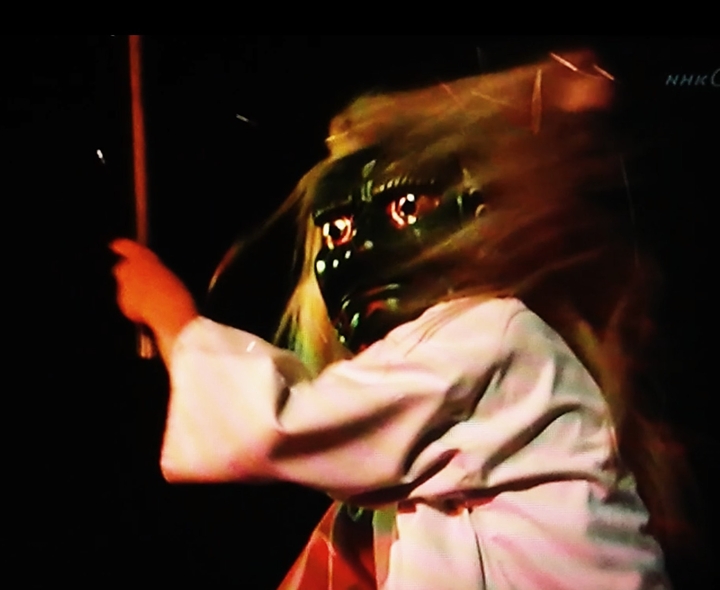 demon-masked drummer