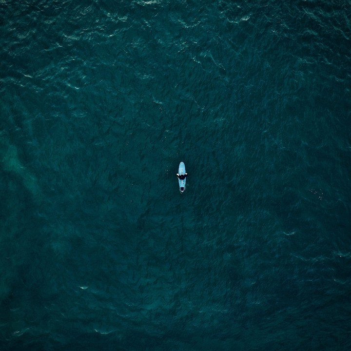 Surfer Surfing Top View