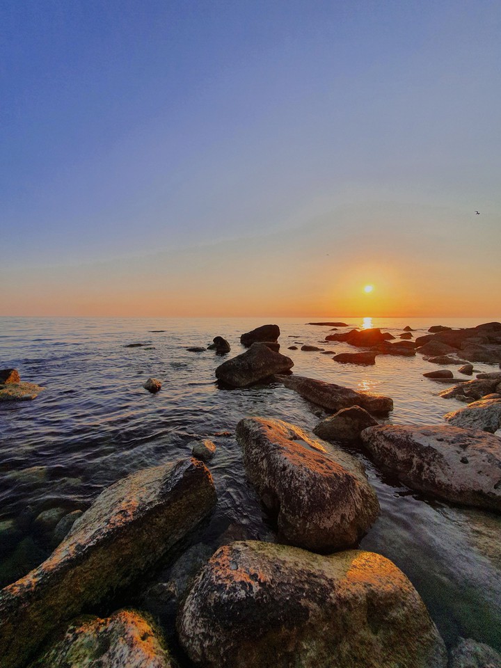 Sunset through the stones