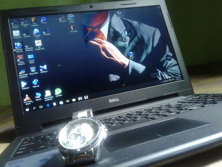 Black Laptop & Silver Watch....