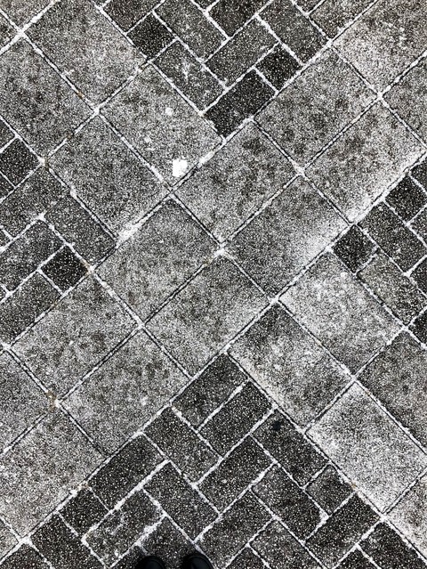 bricks in snow with shoes