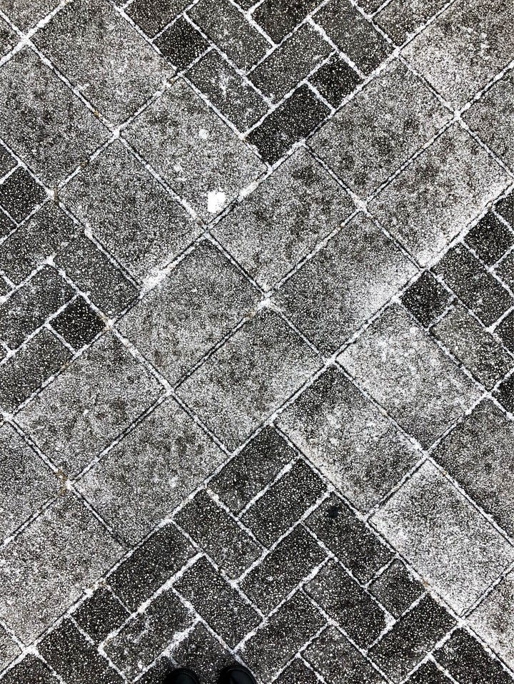 bricks in snow with shoes