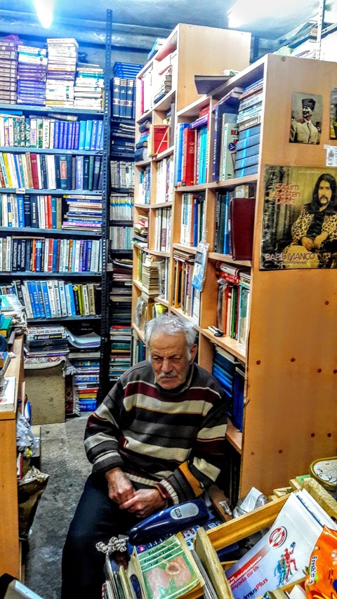 old man and antiquarian (old books store)...