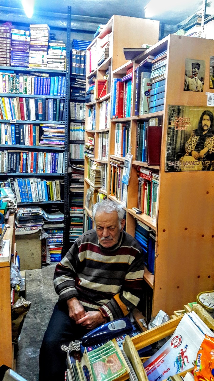 old man and antiquarian (old books store)...