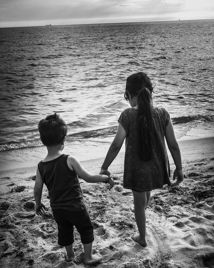 brother and sister/ boy and girl at beach