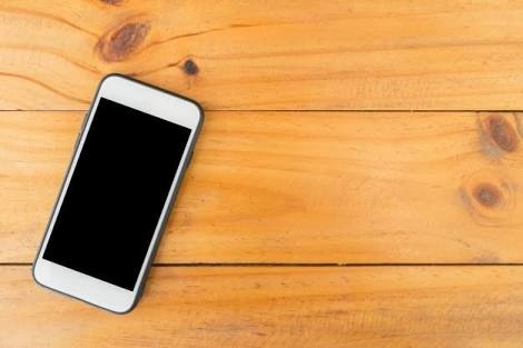 Mobile on wooden table