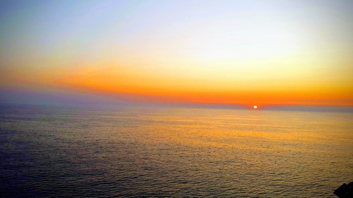 sun setting over the sea