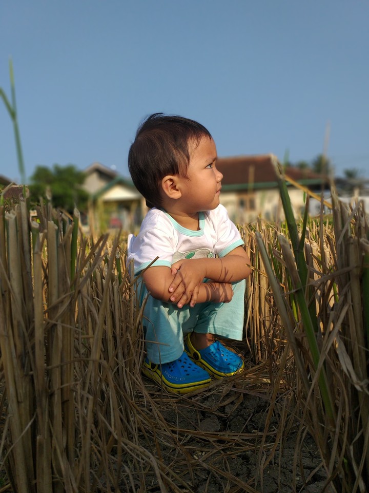 squatting boy