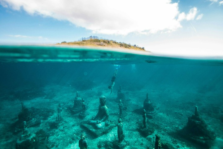 sunken Buddha statue under sea water